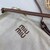 Woven fabric handbag with leather trim
