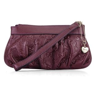 Claret GG Embossed Leather Wristlet with Metal Heart Charm