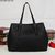 Black woven leather shoulder bag